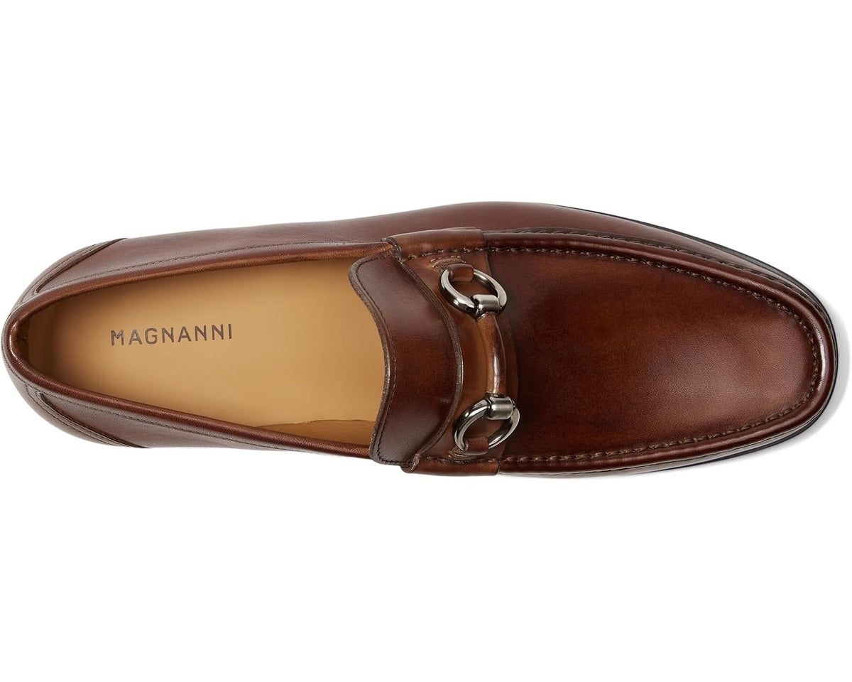 Tabaco leather loafer with bit strap, moc toe stitching, and tan interior lining