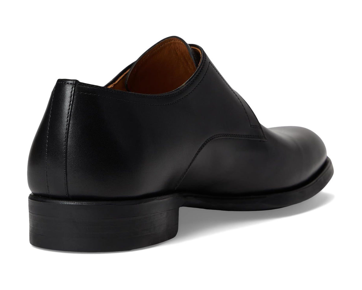 Black leather men's dress shoe heel and back view, tan insole lining.
