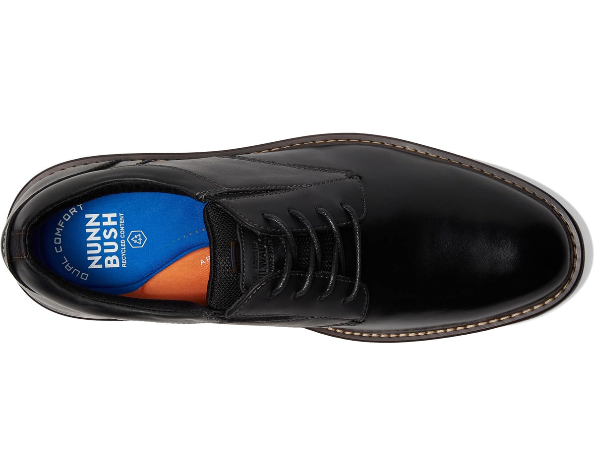 Black leather lace-up oxford with cushioned interior and brown stitched welt