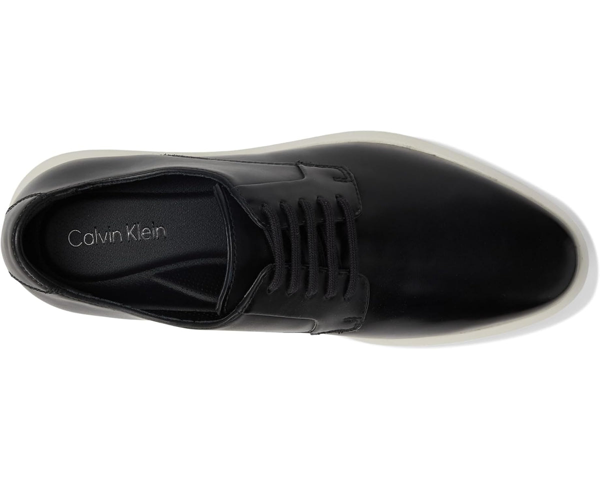 Black sneaker with Calvin Klein logo on tongue, lace-up design and cushioned collar