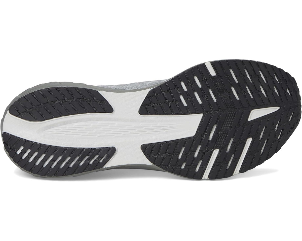 White and black rubber outsole with traction grooves for running shoes