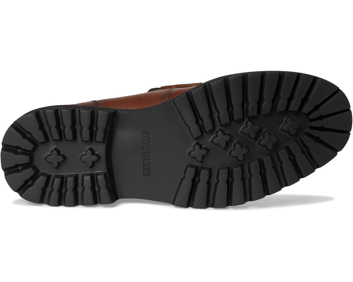 Tan leather loafer outsole with textured tread and traction lugs