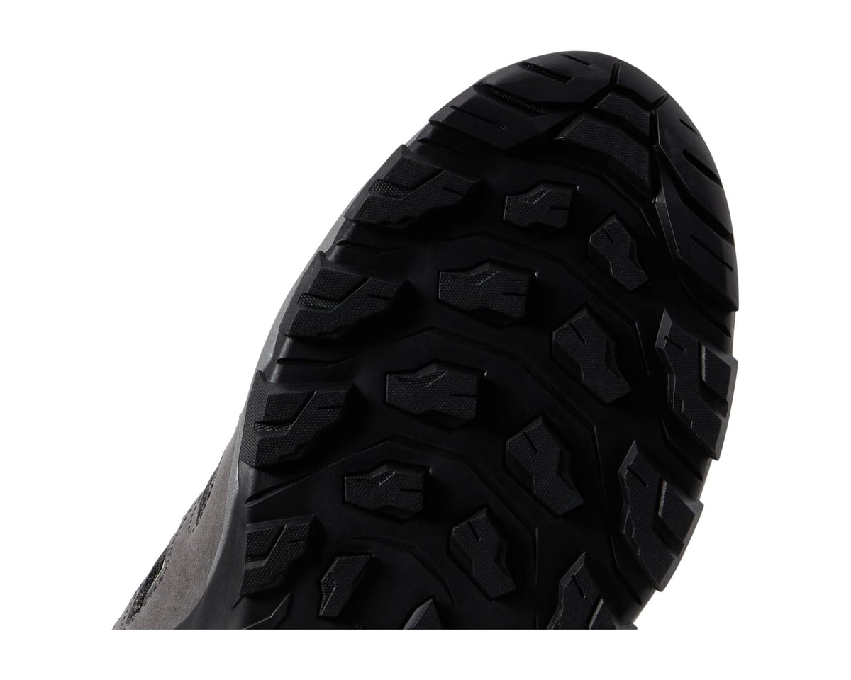 Close-up of black lug outsole tread on an anthracite hiking shoe
