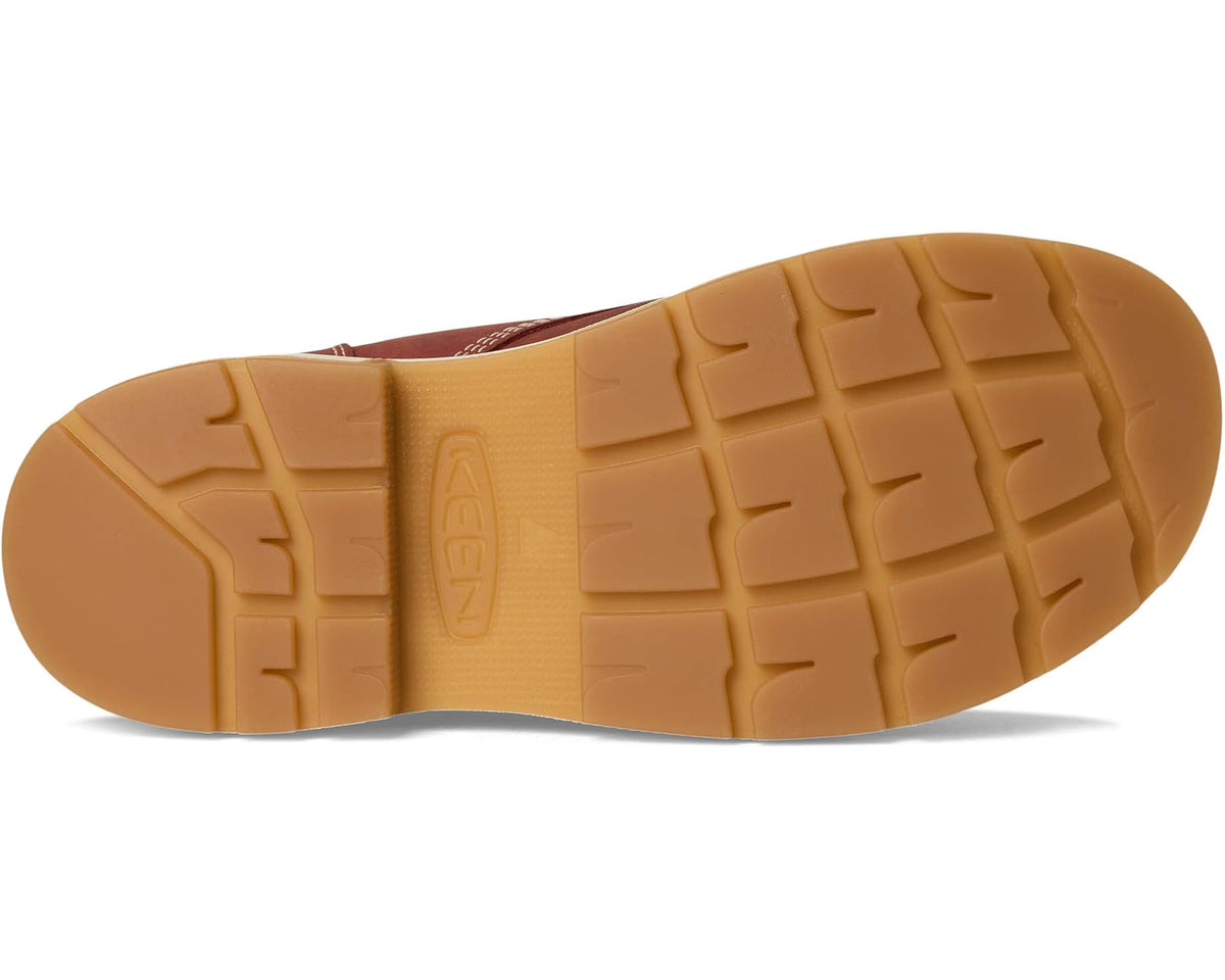 Men's work boot outsole in light tan with deep tread pattern