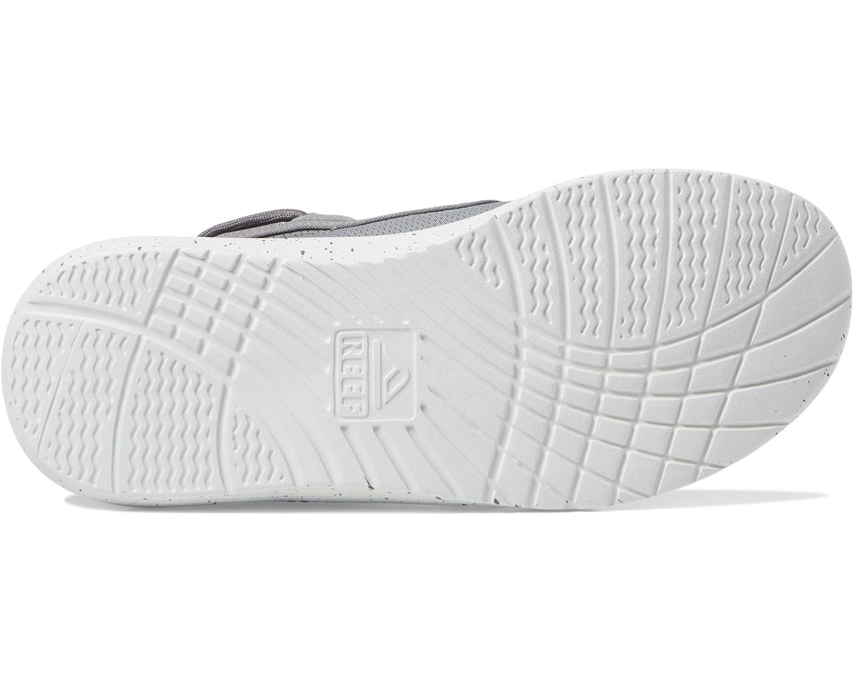 White rubber outsole with textured tread and embossed logo on grey shoe