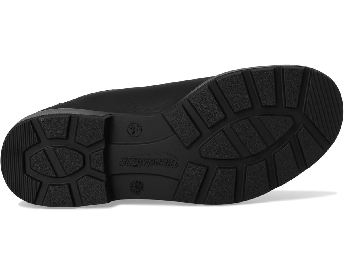 Black rubber boot outsole with deep tread and geometric traction pattern