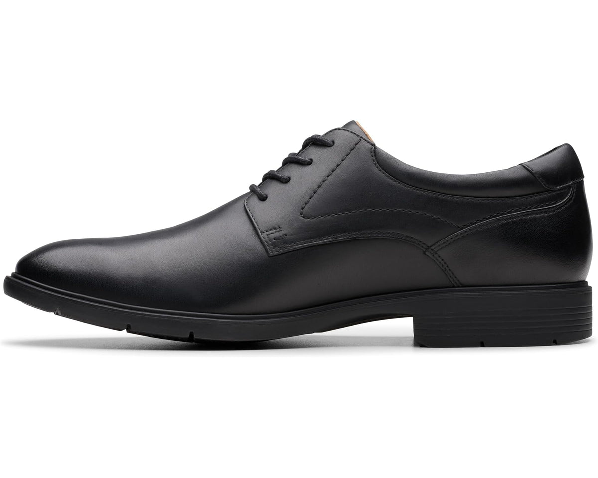 Men's black leather lace-up oxford shoe with low-profile sole and seam details
