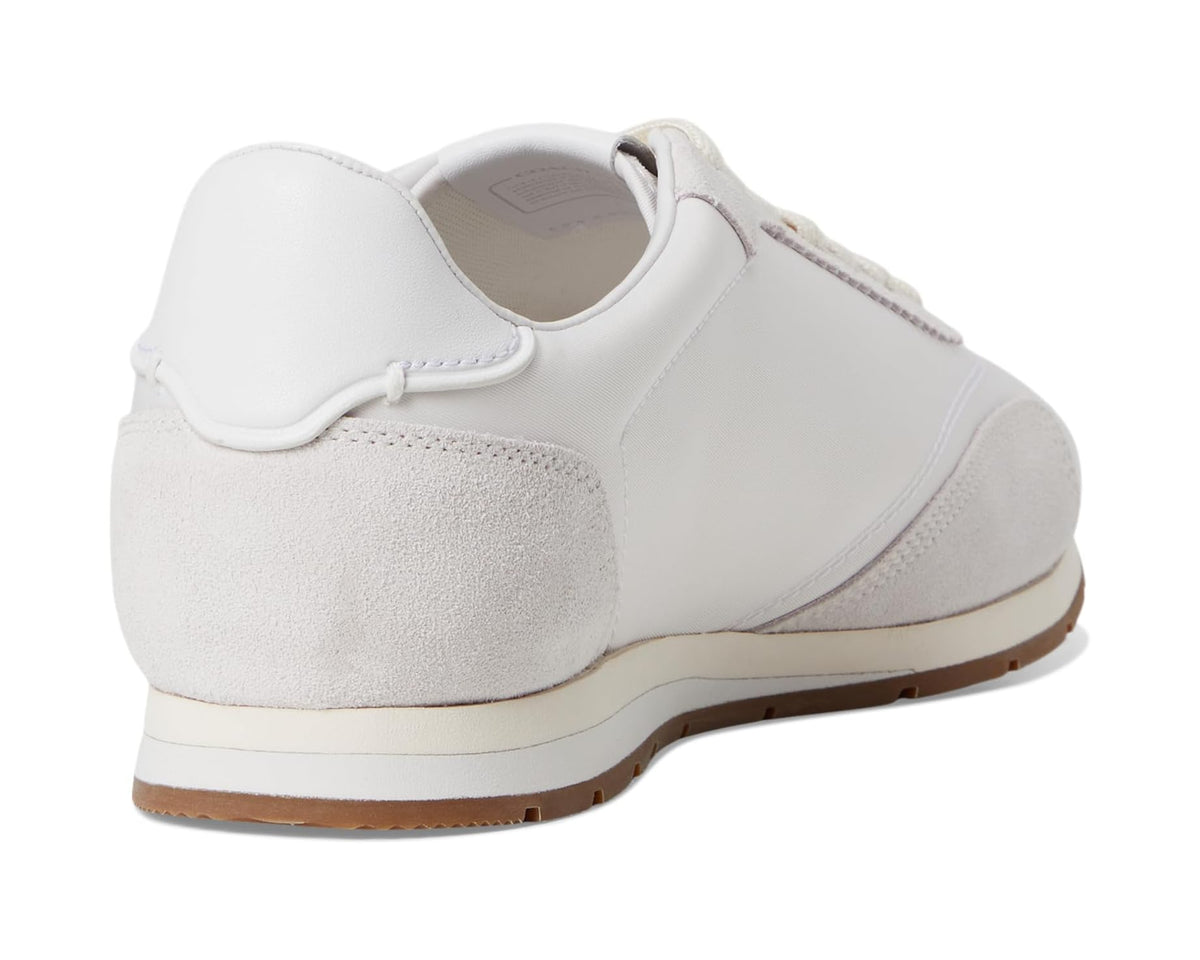 COACH flat sneakers heel view in optic white suede-style panels with brown sole