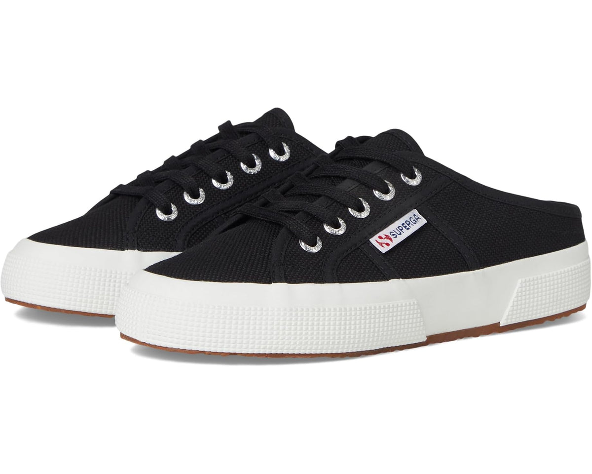 Black canvas mule sneakers with lace-up front and white rubber sole.