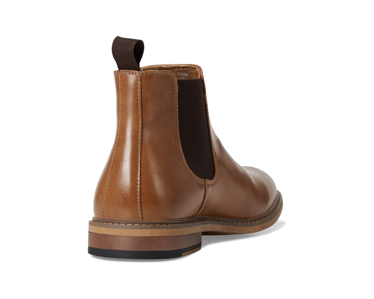 Tan leather Chelsea boots from back view with elastic gore and stitched trim