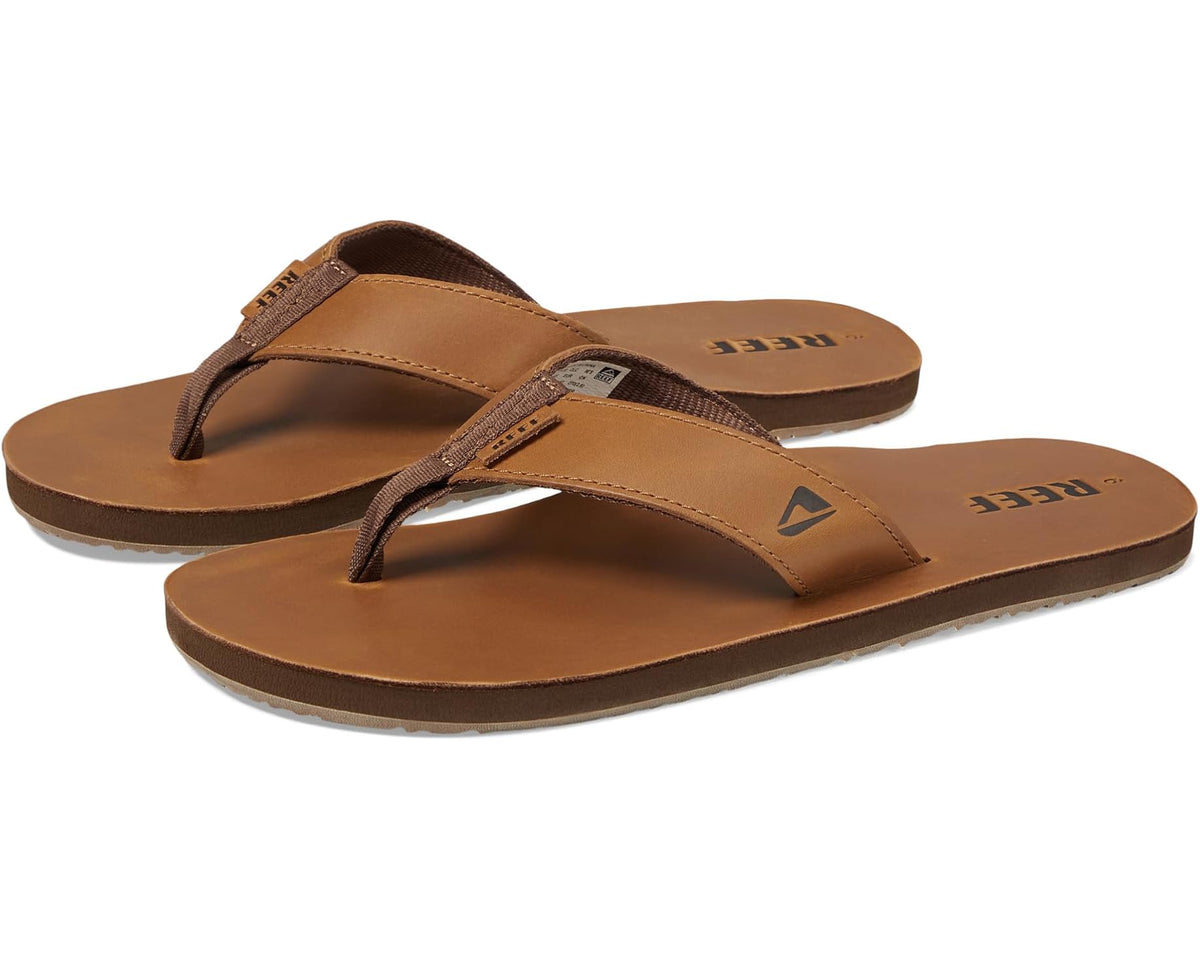 Men's Reef leather flip-flops in bronze-brown, thong style with stitched straps.