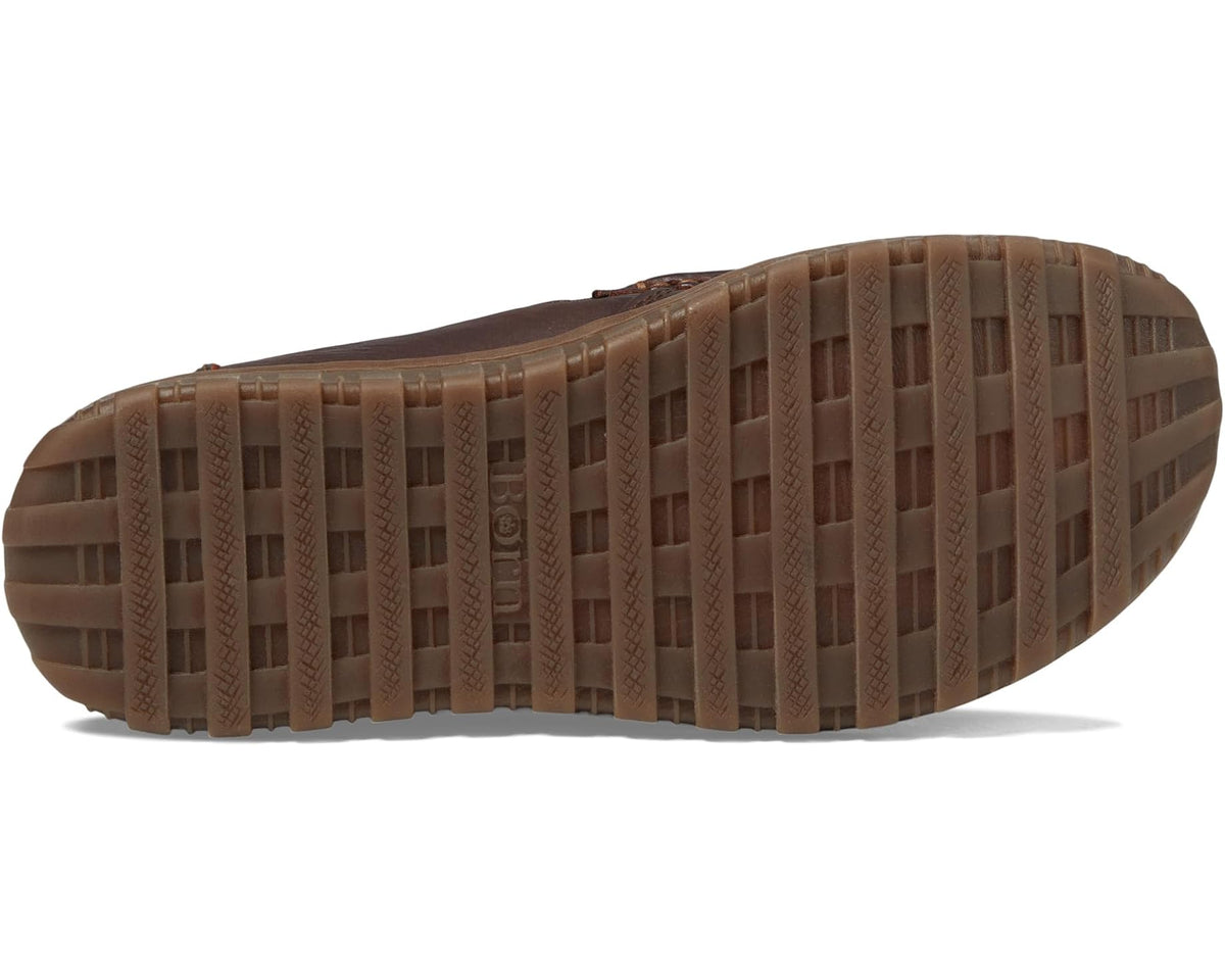 Men's Born dark brown leather slip-on loafer showing rugged rubber tread outsole