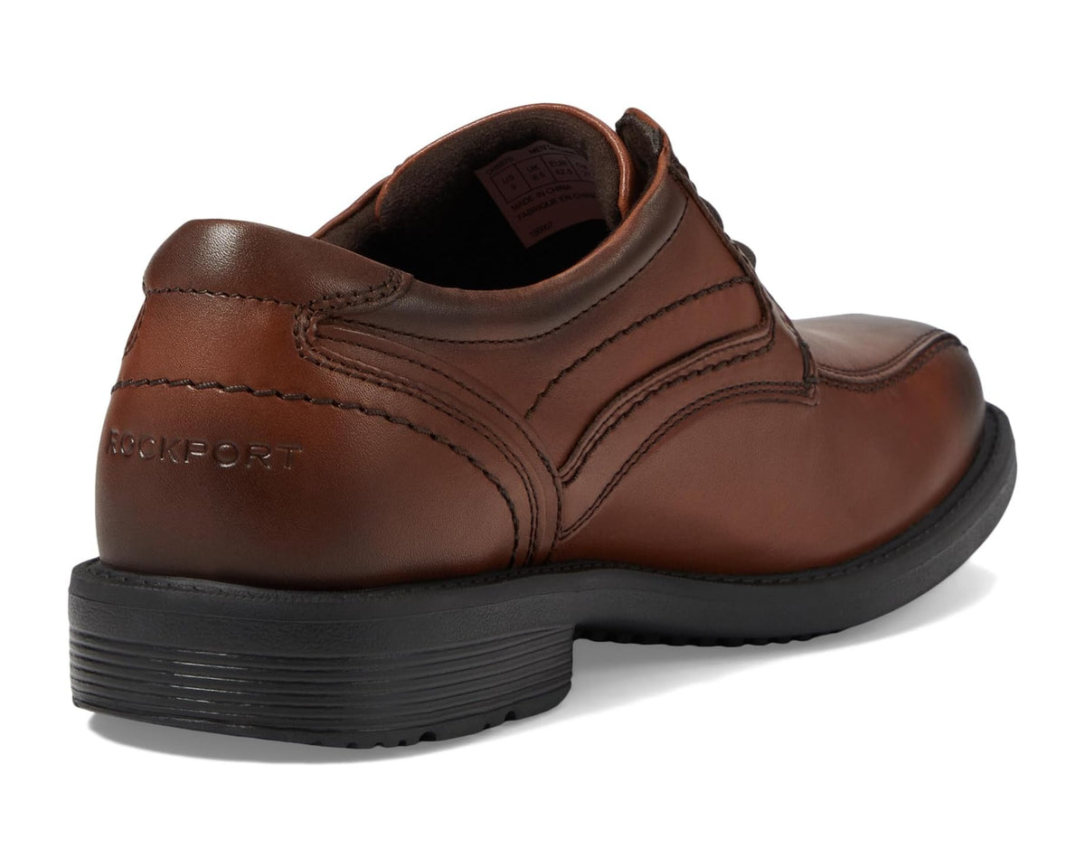 Men's Rockport brown gradient oxford heel view with rear branding and padded collar