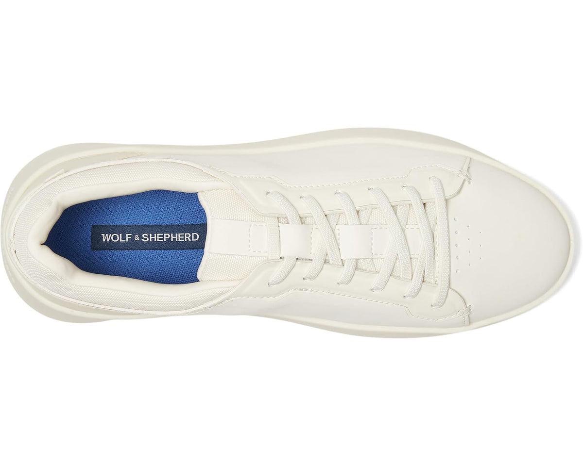 Off-white sneaker interior with blue lining and WOLF & SHEPHERD logo tag