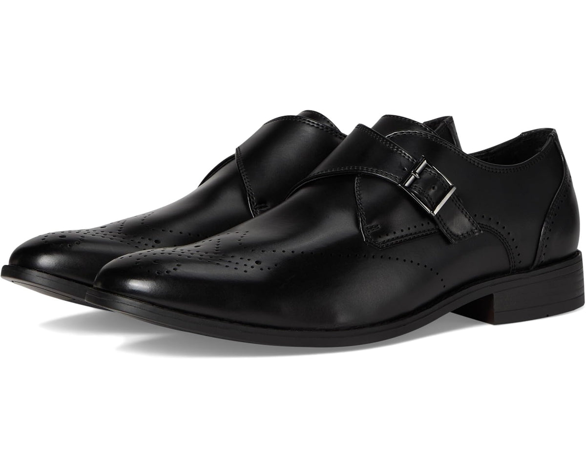 Black leather monk strap dress shoe with perforated detailing and buckle closure