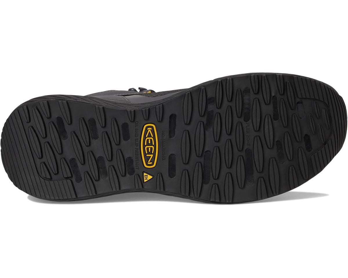 Waterproof work boot outsole with deep tread and yellow KEEN logo detail.