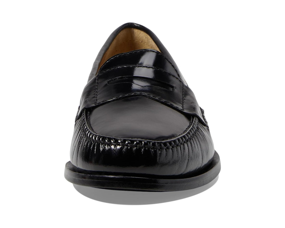 Black patent leather penny loafer with rounded toe and penny strap