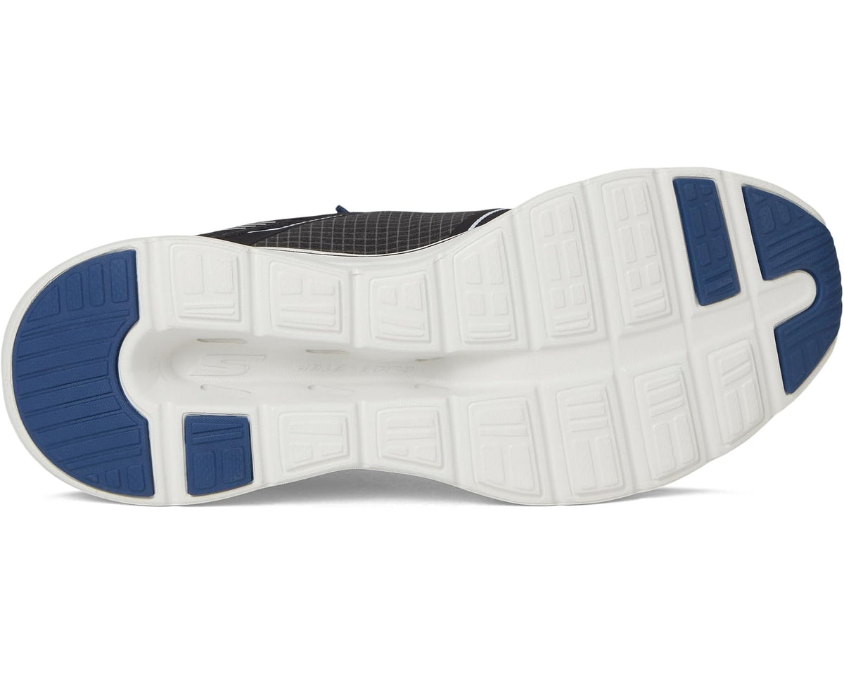 Black and white sneaker outsole with blue heel pods and treaded grooves