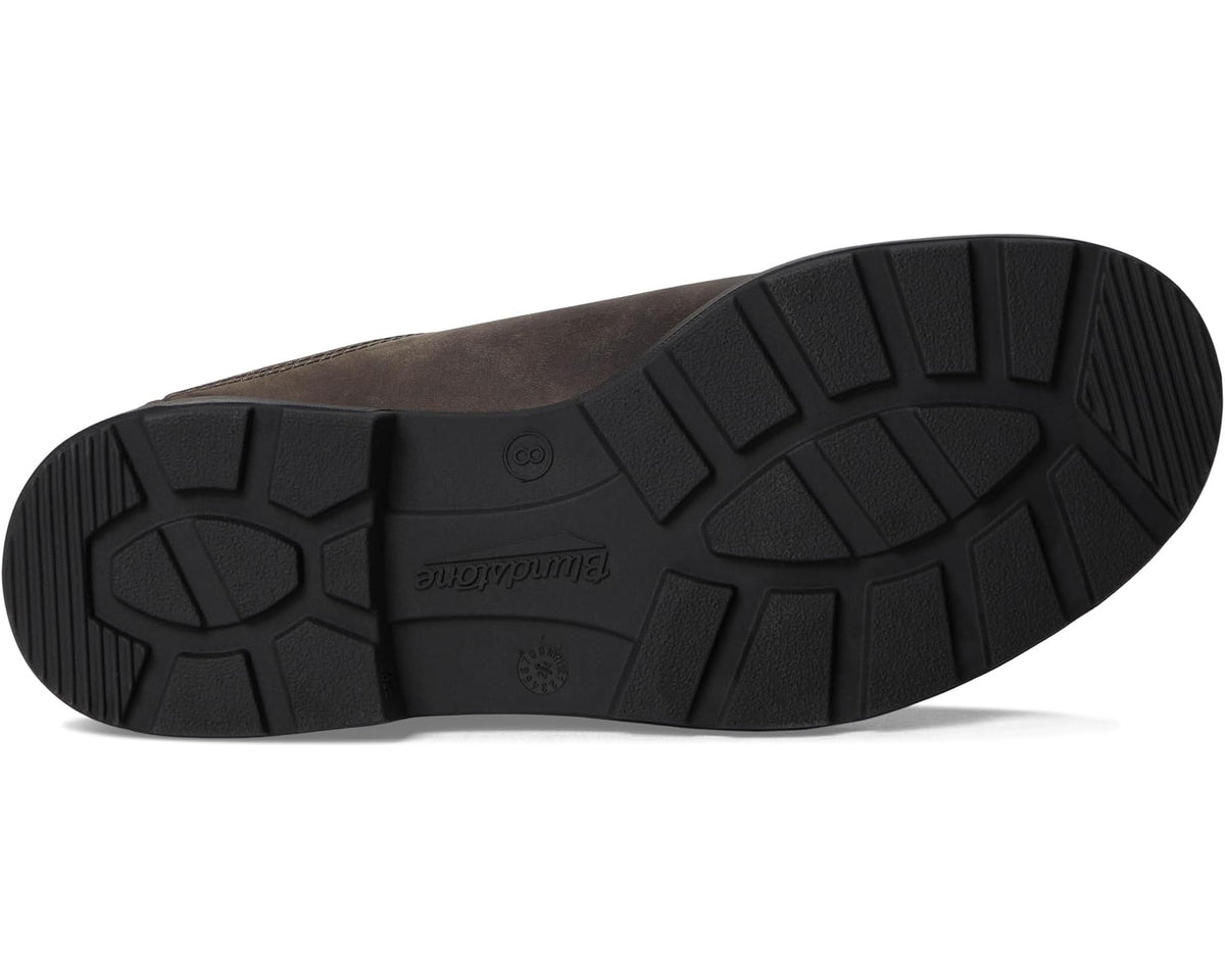 Slip-on clog outsole with rugged tread and embossed logo on black rubber