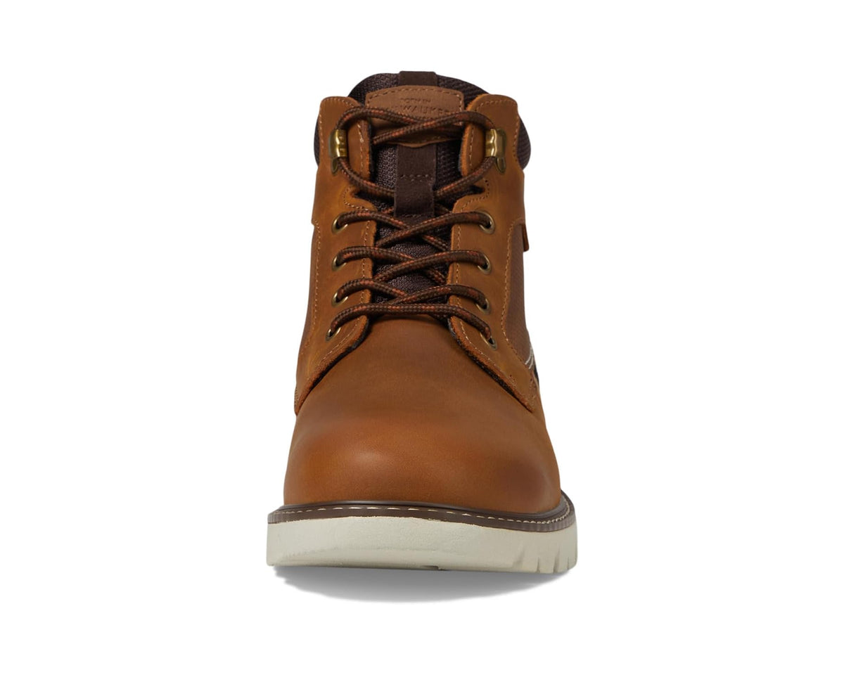 Tan lace-up chukka boots, front view with padded collar and rubber sole