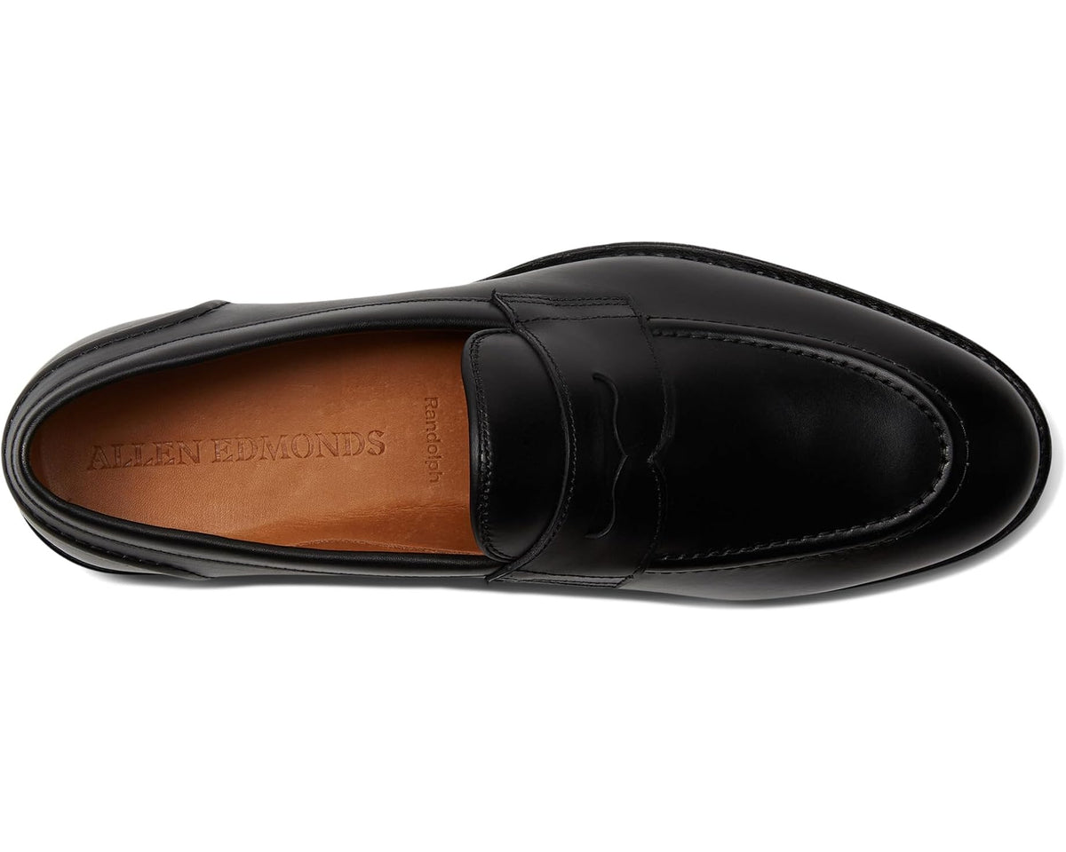 Black leather penny loafer top view with strap and stitched seams