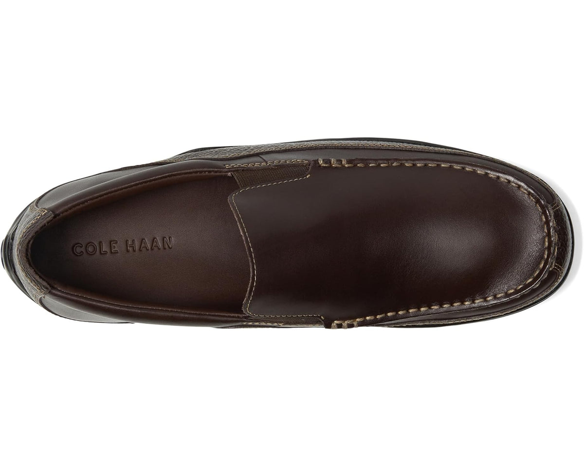 Dark brown leather loafer with stitched apron seam and Cole Haan logo on vamp