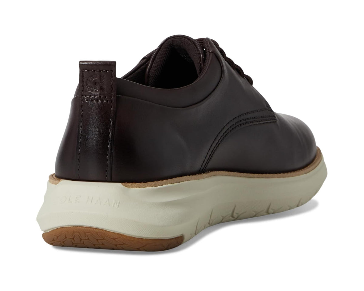 Men's dark brown oxford shoe heel view with padded collar and textured sole