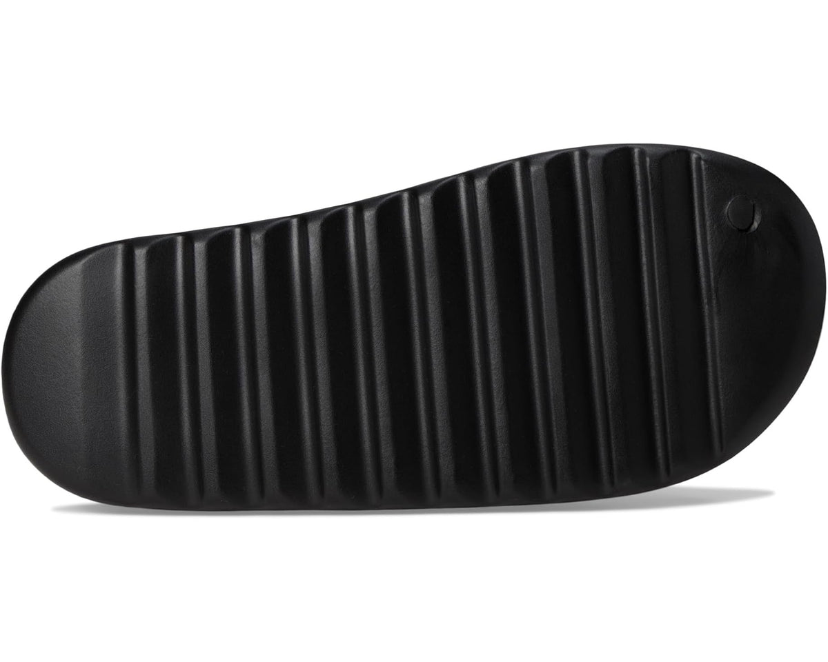 Black rubber slide sandal outsole with ribbed tread and small logo marks