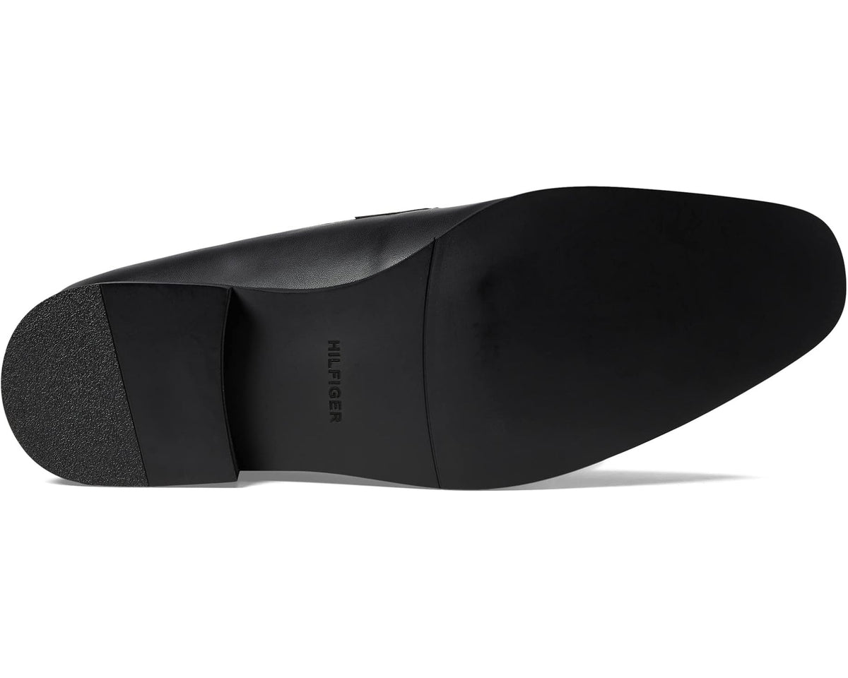 Men's black leather loafer outsole with textured rubber heel and logo