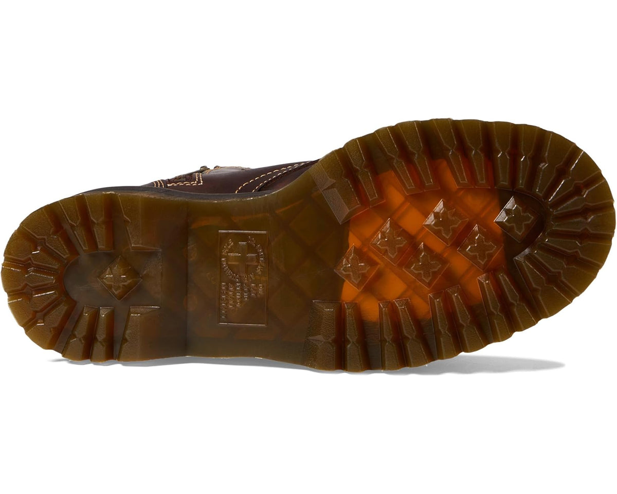Dark brown boot outsole with rugged tread and star-pattern insets
