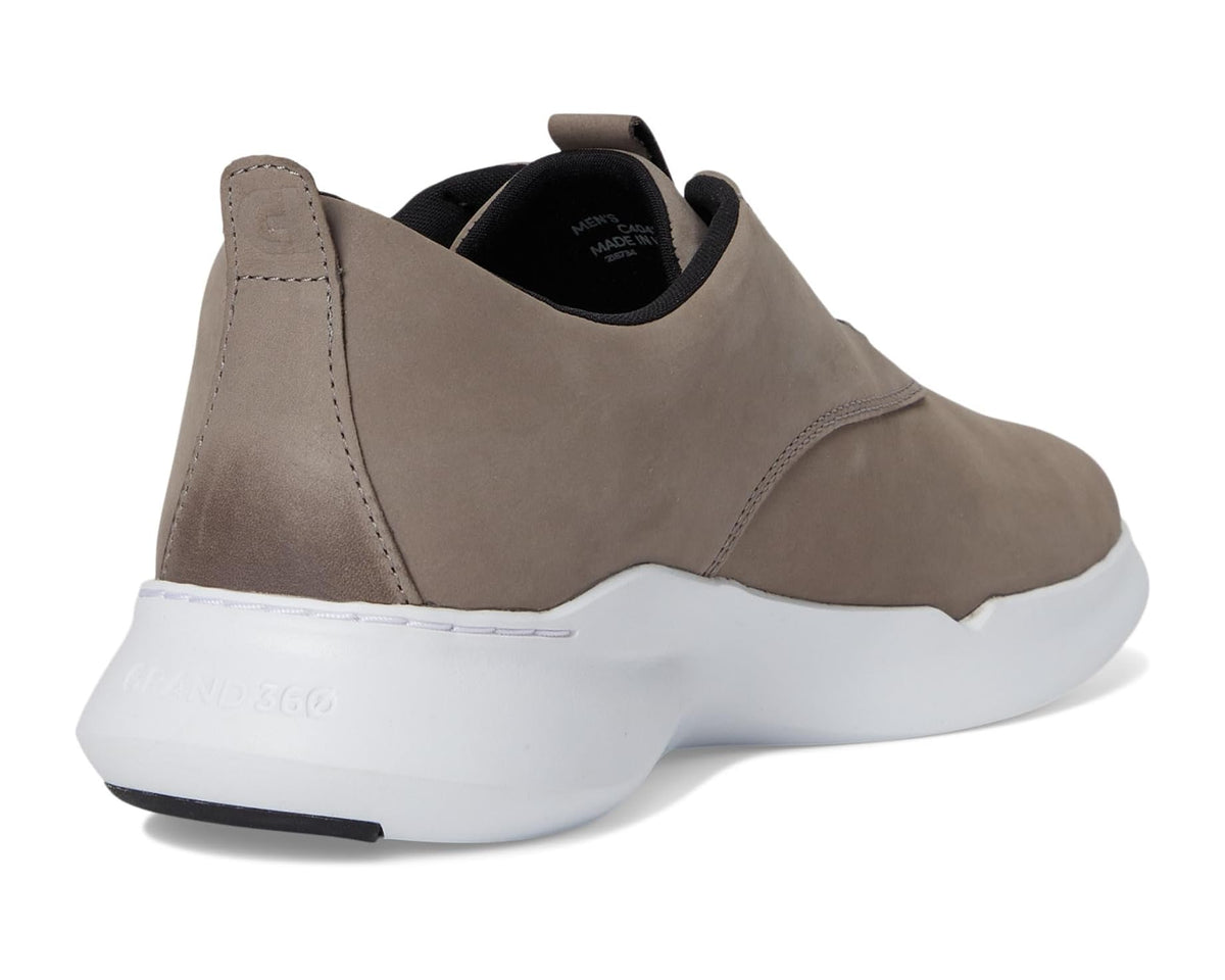 Grey nubuck sneakers rear view with cushioned collar and white sole