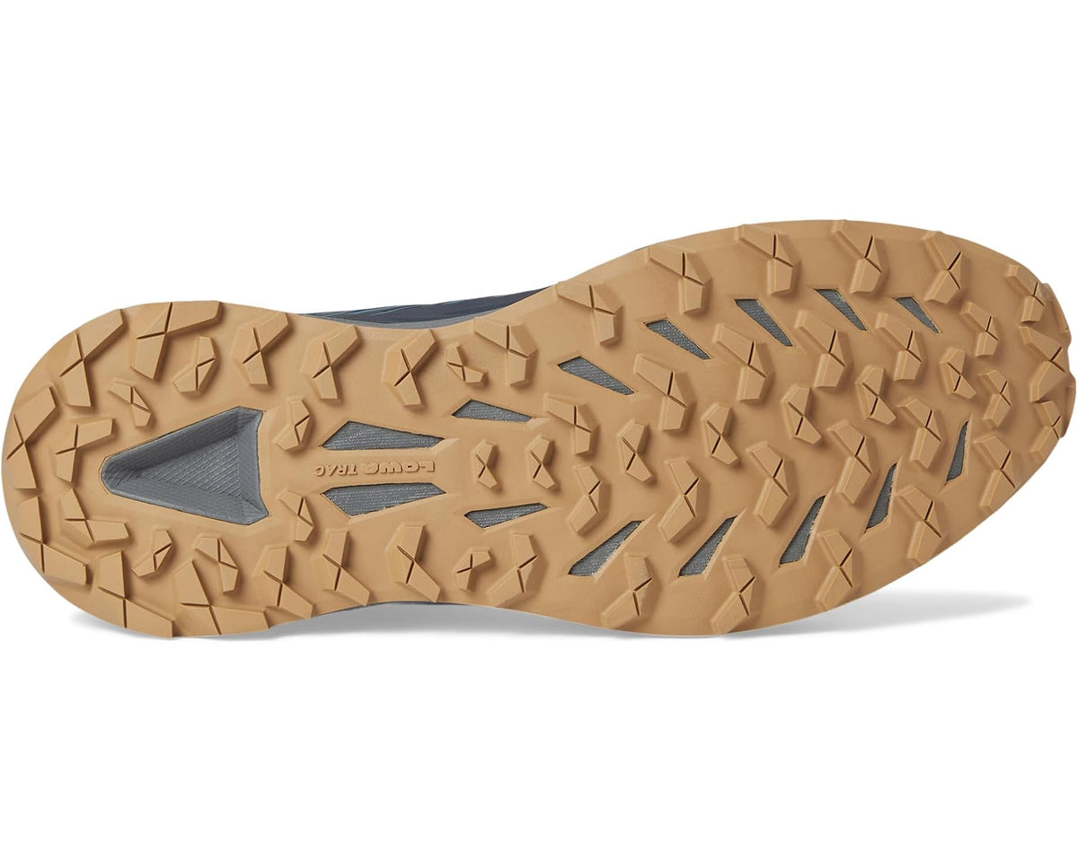 Men's dark navy shoe sole with tan traction lugs for outdoor grip