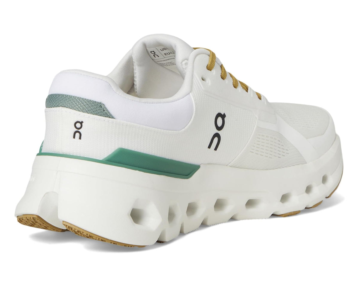 Men's white running sneakers with green heel panel, padded collar, and gold lace detail