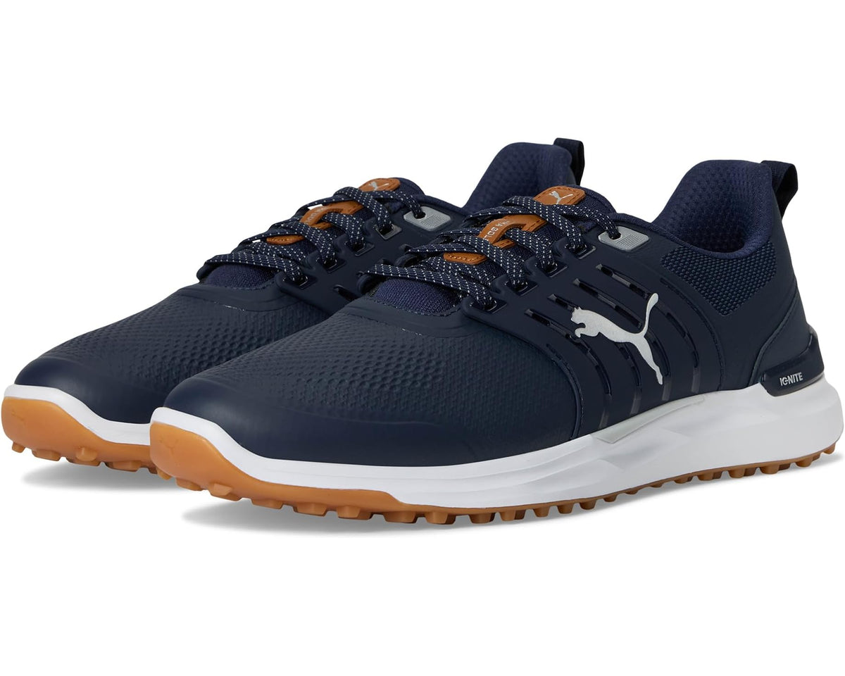 Men's PUMA golf shoes in deep navy with orange-brown outsole and silver logo