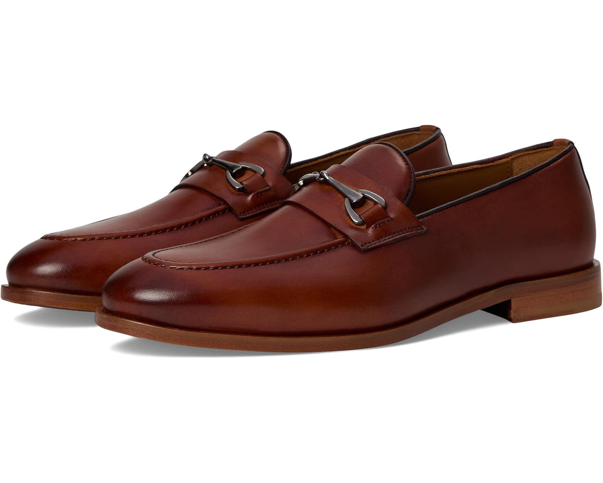 Men's brown leather loafer with metal buckle strap and low profile sole
