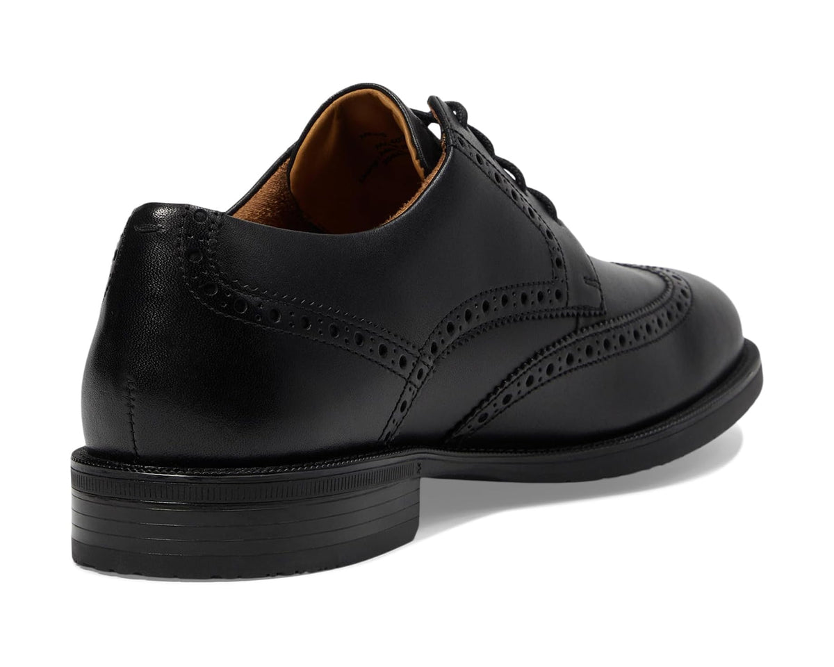 Black leather wingtip oxford with cushioned collar and brown lining