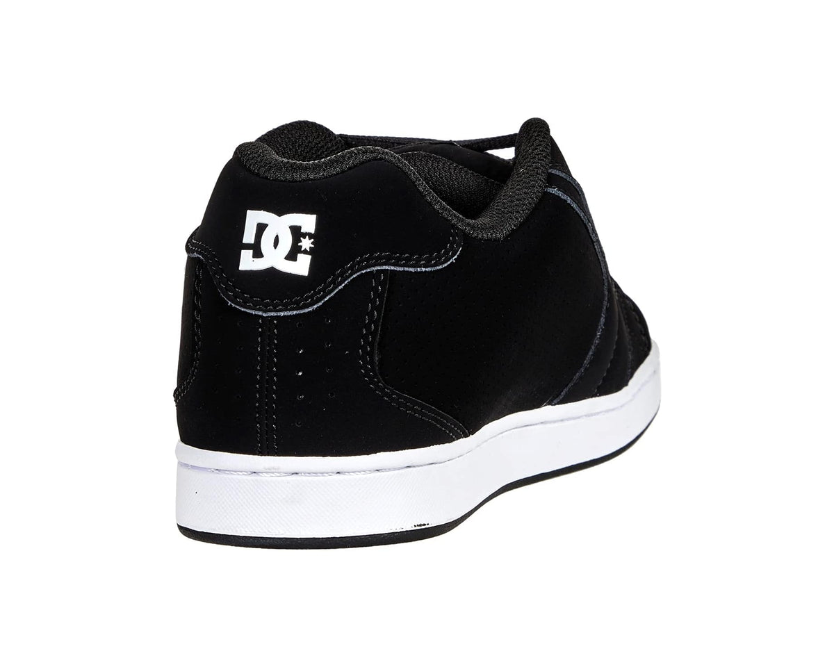 Men's black DC skate shoe heel, with white DC logo patch and white midsole.