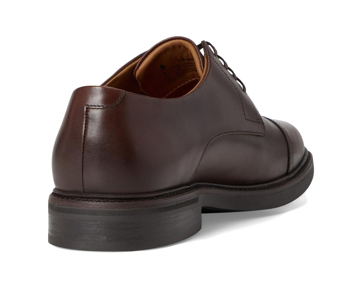 Brown leather lace-up oxford with stitched heel and textured dark outsole.