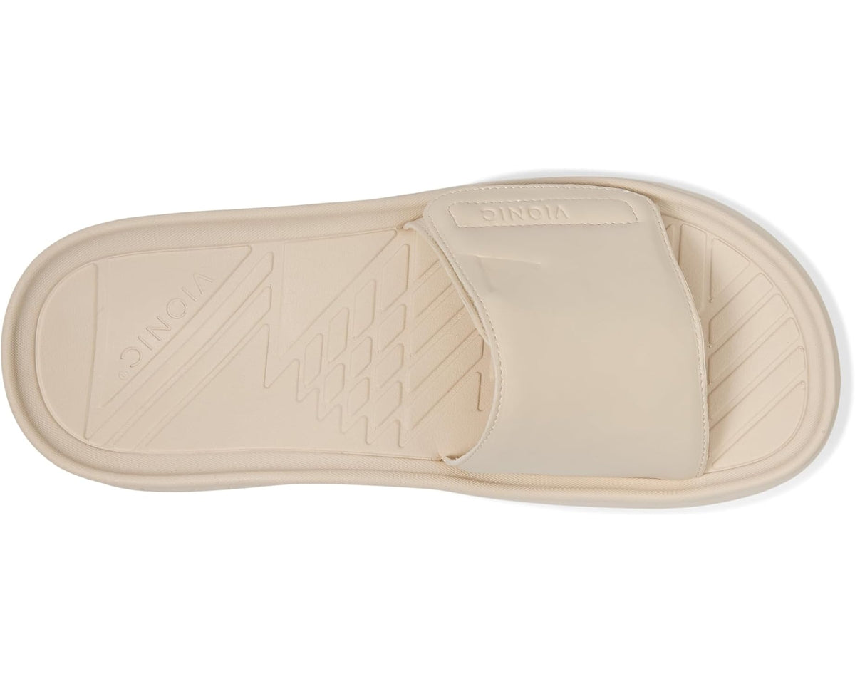 Cream slide sandal outsole and sidewall tread detail