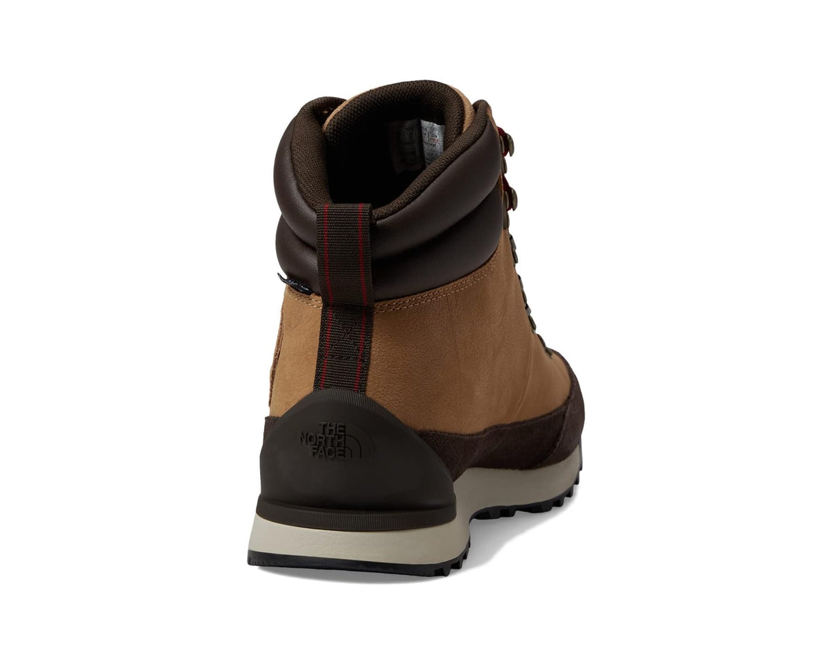 Back view of tan waterproof hiking boots with black heel panel and padded cuff