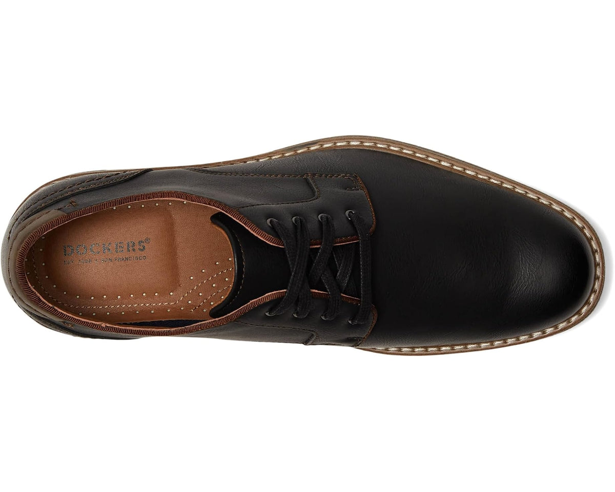 Black leather lace-up shoe, side view with tan sole and brown laces.