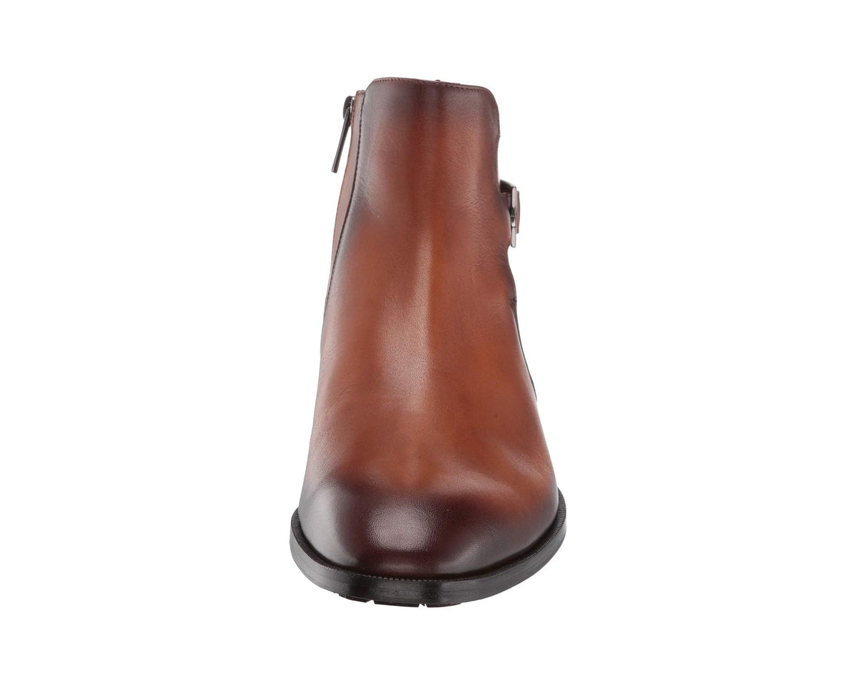 Men's cognac leather ankle boot heel view with smooth upper and dark rubber sole.