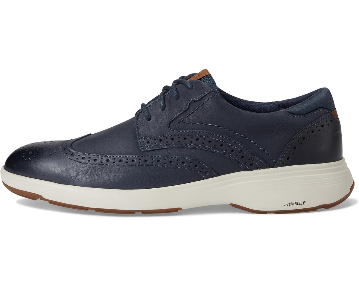 Men's dark blue leather wingtip lace-up sneaker with brown-trimmed sole