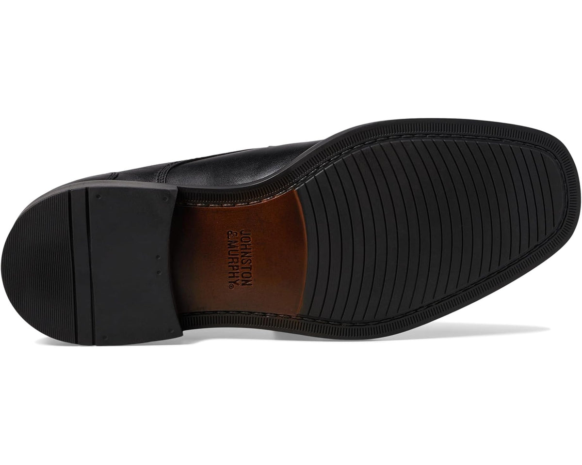 Black leather lace-up shoe outsole with textured rubber tread