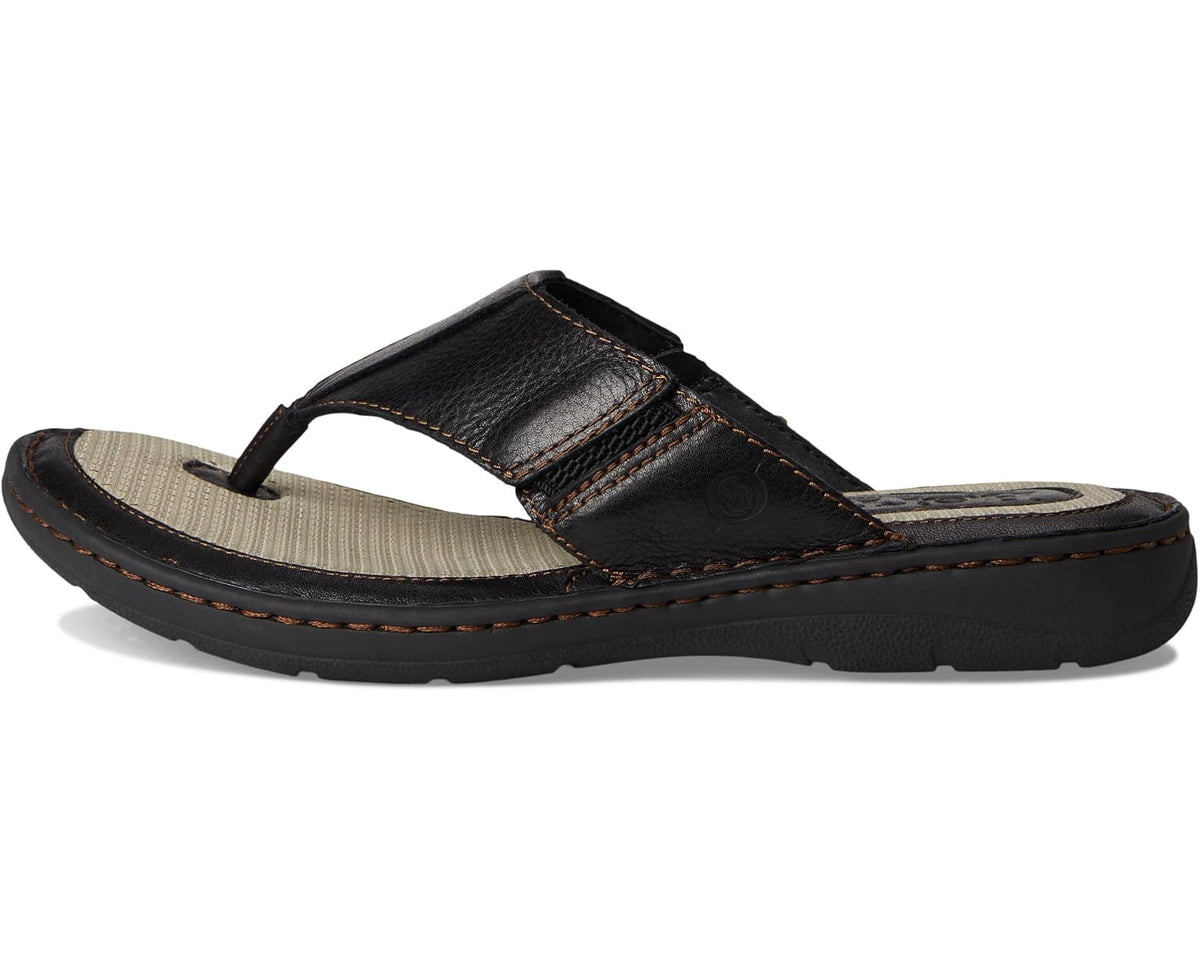 Men's black leather slide sandal with tan sole insert and stitched thong strap