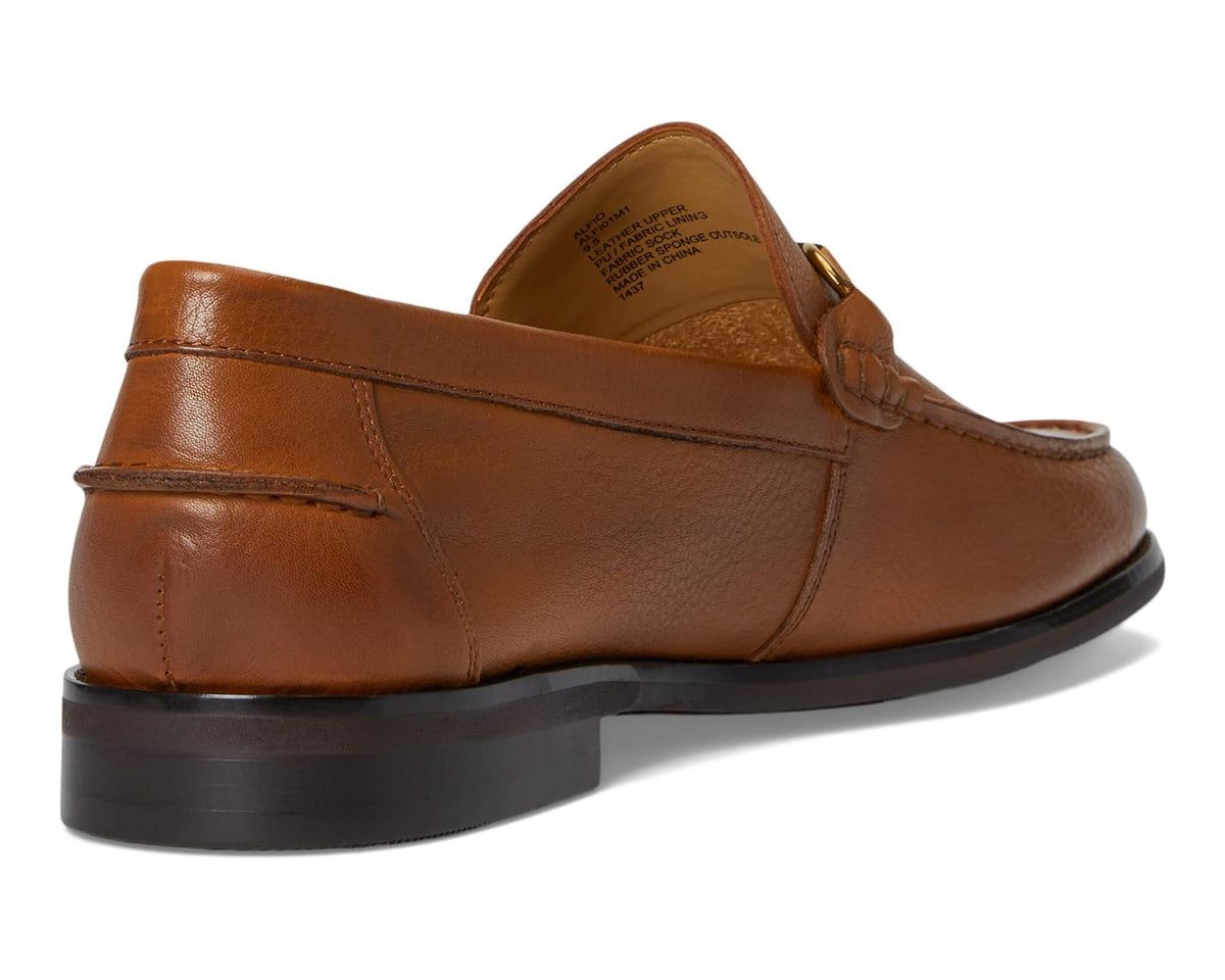 Tan leather loafer heel view with dark sole and stitched seam