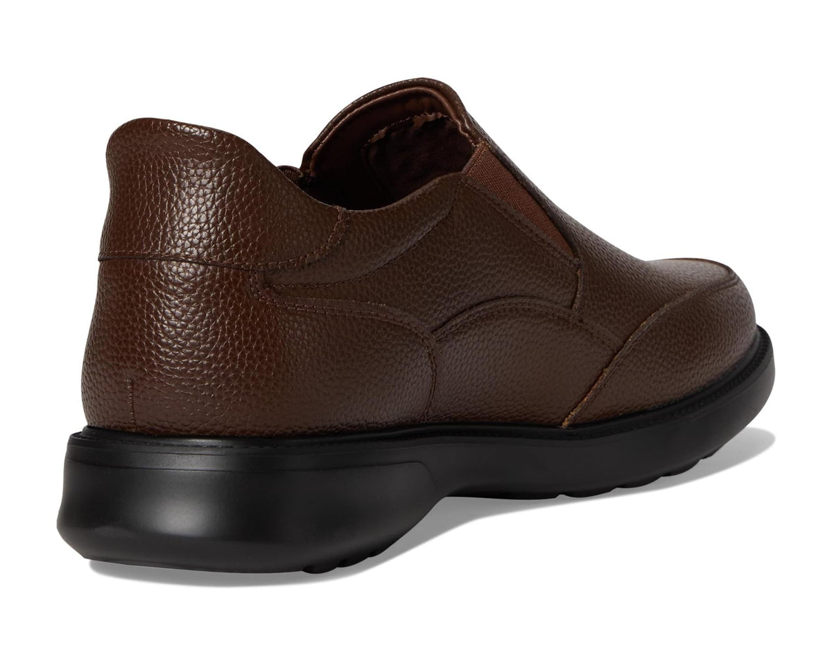 Brown leather slip-on shoe rear view with black rubber sole and heel panel