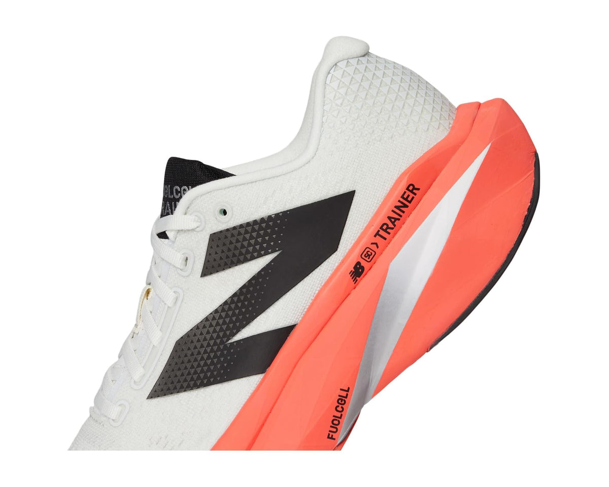 New Balance FuelCell trainer shoe side detail, white upper with black logo and orange accents