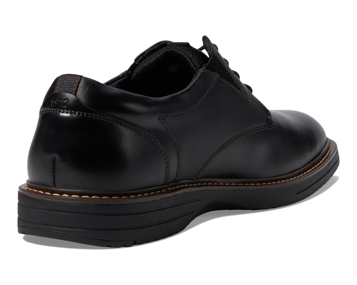 Black leather oxford shoe with lace-up closure and cushioned heel collar