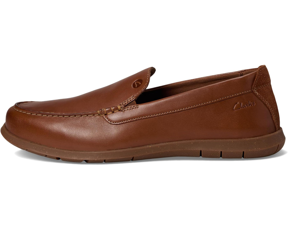 Men's tan leather loafer side profile with stitched seam and flex sole